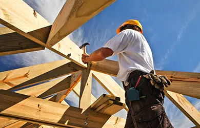 Roofer Carpenter Working on roof