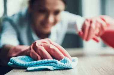 young smiling woman gloves cleaning house